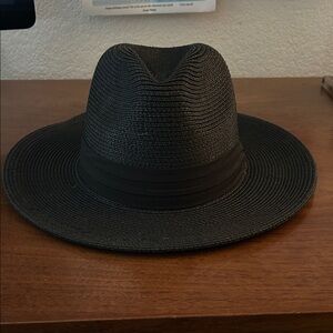 Straw hat with black ribbon